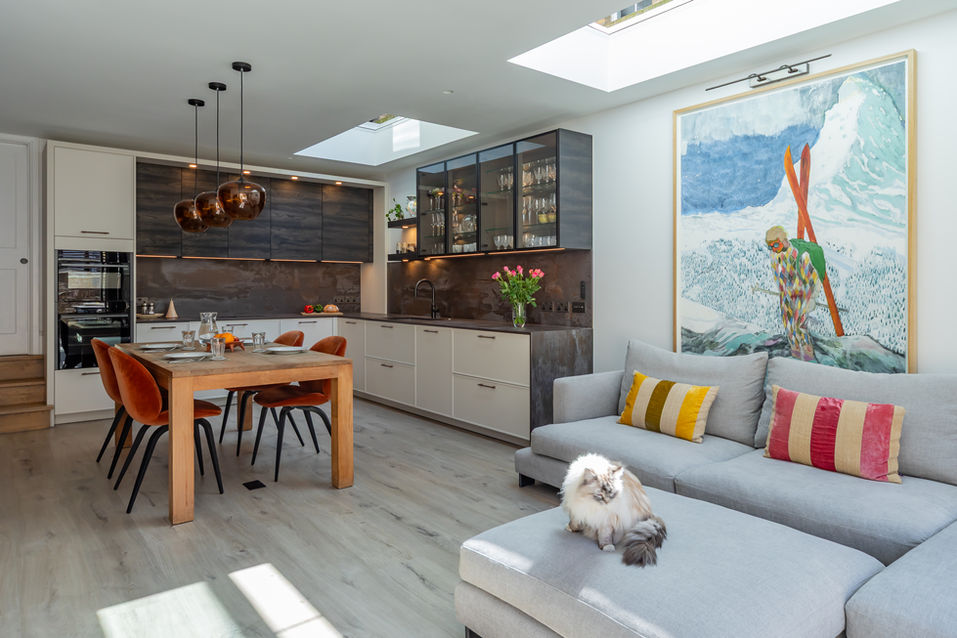 Open-plan kitchen and living area photographed to show flow, light and layout
