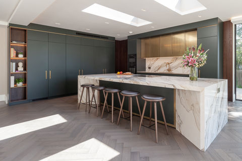 Bespoke kitchen with marble waterfall island and skylights, Borehamwood
