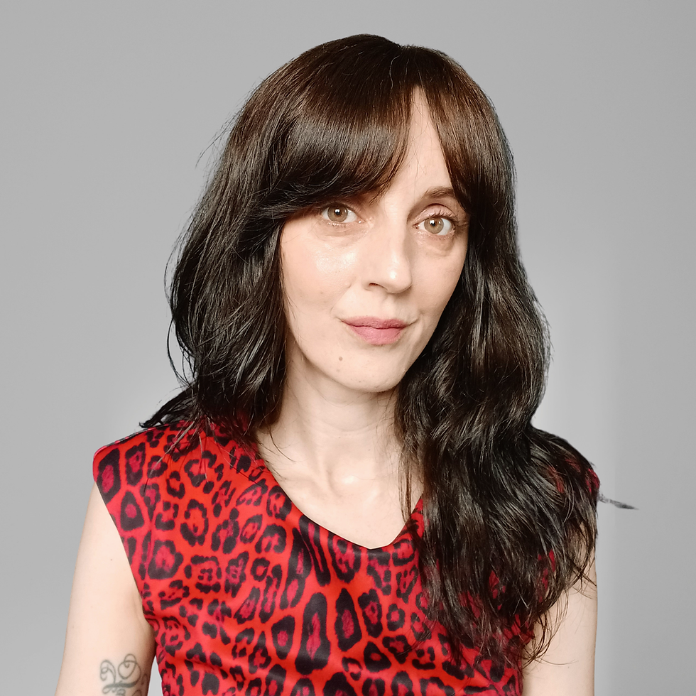 Bekki has brown hair and is wearing a red leopard print top
