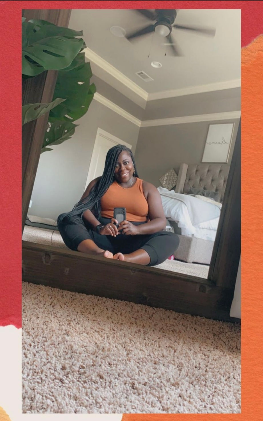 Picture of the founder/CEO of Radiant Interior Designs. She's sitting on the floor of a bedroom.