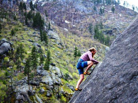 man climbing mountain