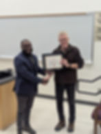 Dr. Jody Redepenning, Chair of the Department of Chemistry, presents the award to Manny