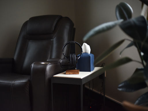 Calm ketamine therapy treatment room with chair and headphones at Kalea Wellness in Henderson, Nevada