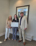 Alyssa Blitch, COO, accepts check from Paige & Michael at Carolina Cares.