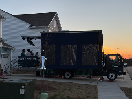 Driveway transformed into birthday party entertainment setup with Mobile Mulligans golf simulator truck