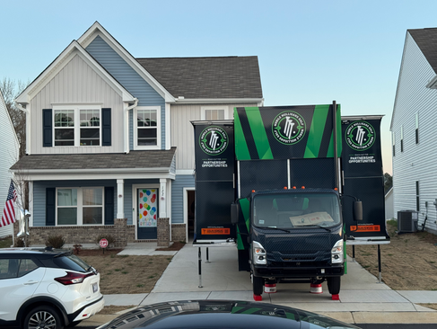Friends entering the mobile golf simulator truck for interactive birthday party entertainment
