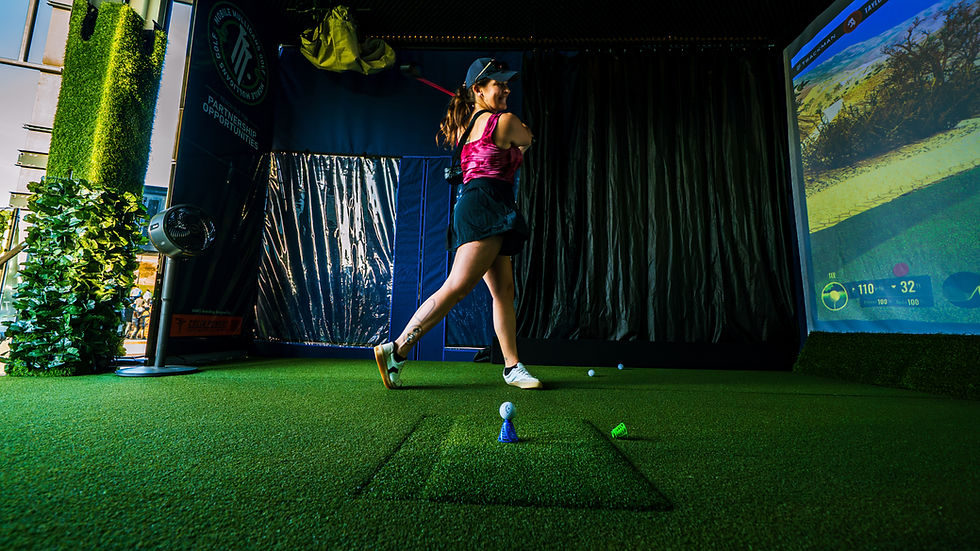 Guest taking a swing on the Mobile Mulligans Golf truck in Winston - Salem, NC