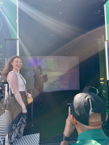 Interactive golf simulator experience inside Mobile Mulligans truck during grand opening event