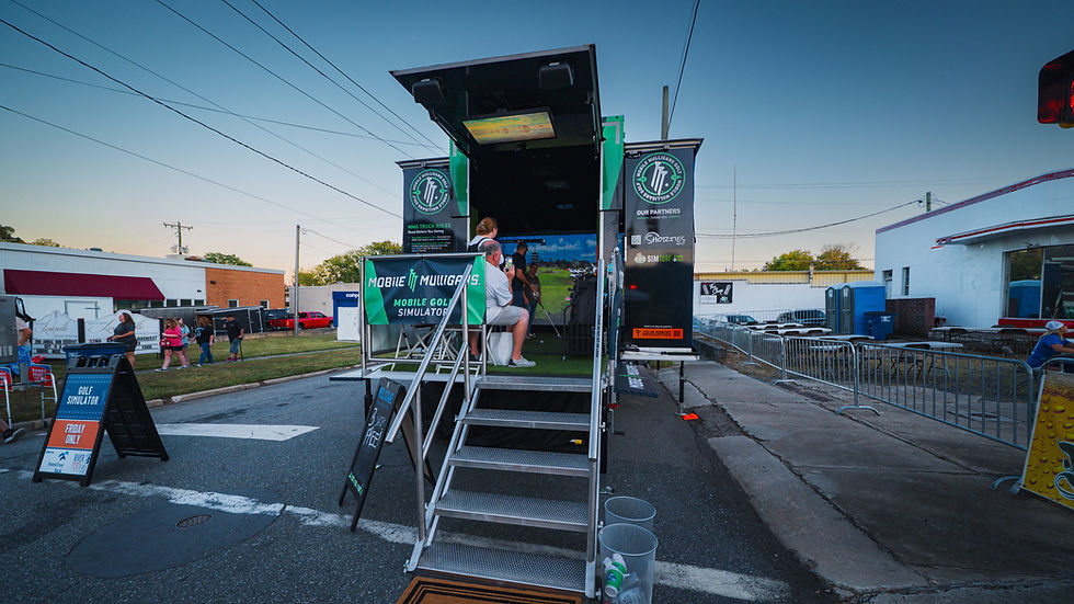 Mobile golf simulator set up at a festival in Eden, North Carolina