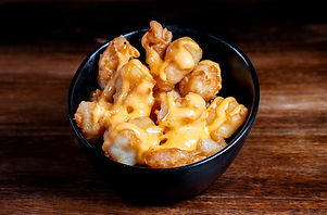 Rock shrimp happy hour bite at Jade Eatery & Lounge, served crispy with house sauce.