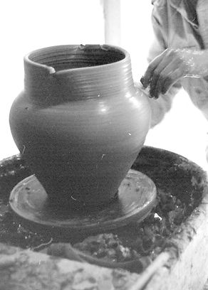 making a large earthenware pot with altered rim.