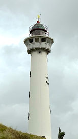 Dutch beach, Netherlands, beach photography, dutch photography, beach vibe, beach aesthetic, sea, blue sea, silver sea, waves, lanterns, parasol, boat, sailing, parasailing, paragliding, beach town, beach village, light house photography, light house, coast guard, beautiful sea, sea picture, buoy, jake zuurbier, Jake Zuurbier photography