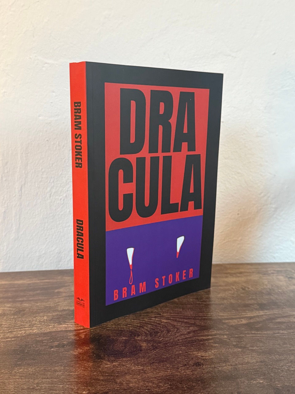 Thumbnail: Dracula, book, classic novel, paperback, sleek, modern cover, vampire book, fangs, purple and red, horror, thriller
