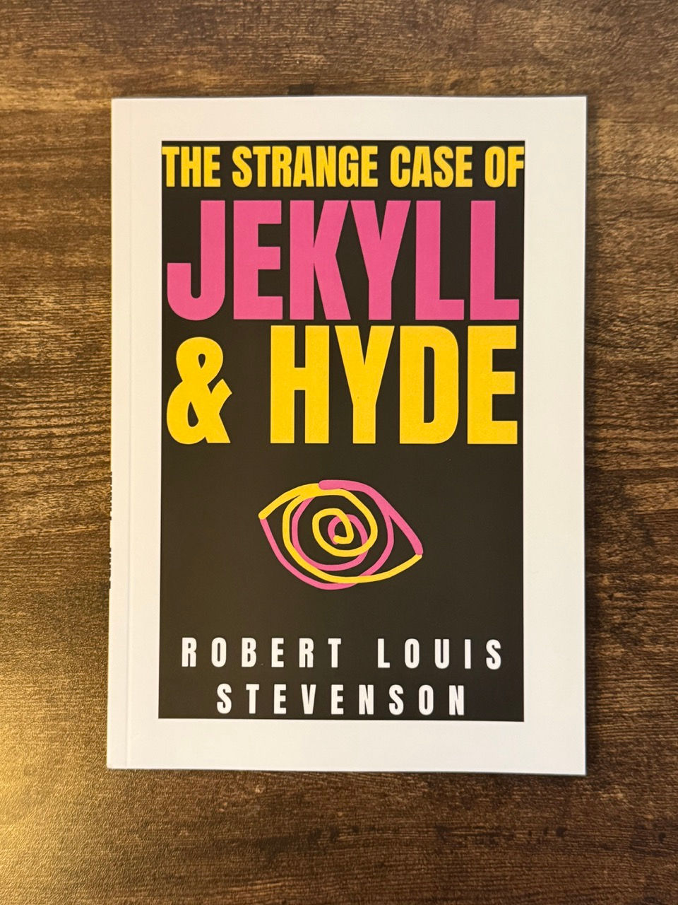 Thumbnail: Jekyll and hide, classic novel, paperback, book, literature, buy book, modern book cover, sleek, yellow and pink, white