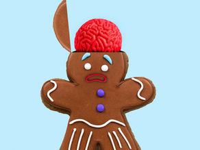 Gingerbread man with his head open and brain showing. Upset face