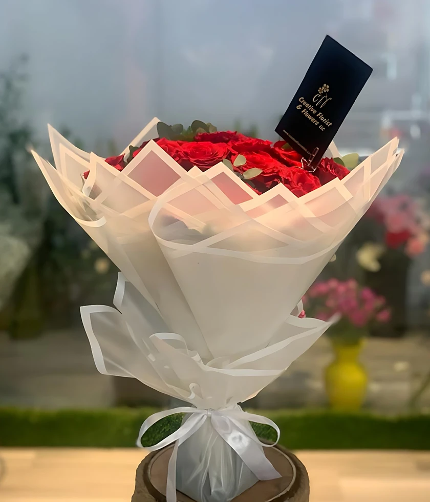 Embrace elegance with Cloud Nine Flower Bouquet, featuring exquisite roses elegantly wrapped.