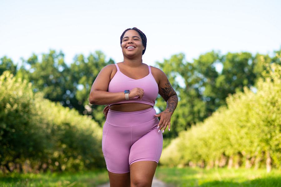 woman smiling while walking outside