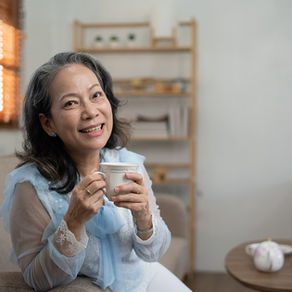 Woman sitting drinking her morning tea