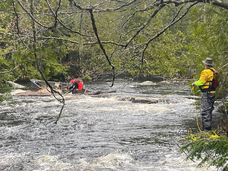 Recovering a broached canoe on the Machias River.
