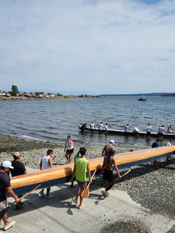 Canoe being loaded into water