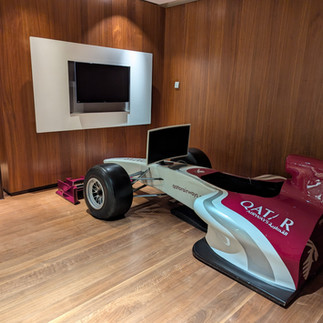 The racing simulator in the family room at the Al Safwa
