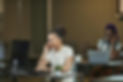 An accountant talking on a headset in an office setting