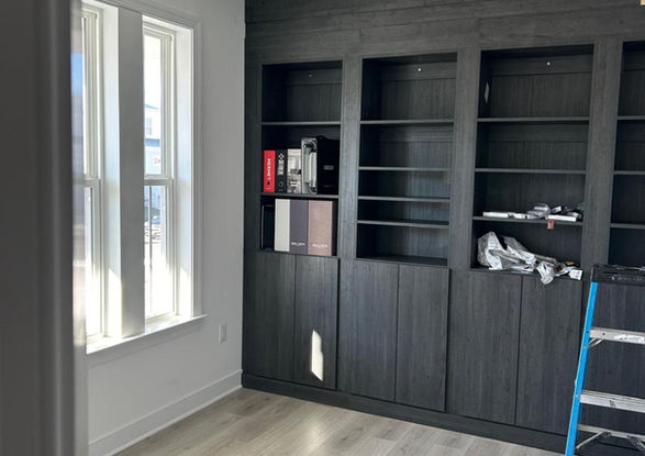 Interior room with dark cabinets, ladder, and a window, Valley Custom Closets.