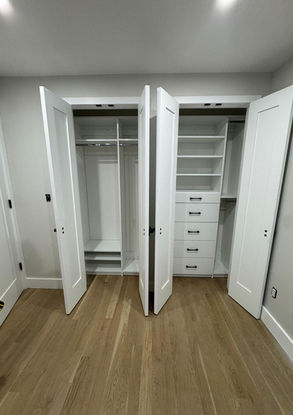 White, open custom closets with shelving, drawers, and hanging rods Valley Custom Closets.