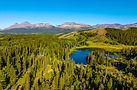 A scenic aerial view of East Glacier Park and Flathead National Forest with a stunning lak