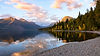 A perfect sunset view from the rocky shores of Lake McDonald in Glacier National Park, Mon