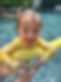 24 Swim School | Child swimming with swim noodle