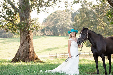 Bride in hat with horse