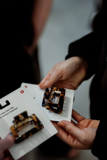 Personalized lululemon hair clip engraving station during a women's networking event in Boston