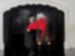 Shahid Malik makes a large lit Candelabra appear in his hand amongst smoke, holding a large red silk fabric.