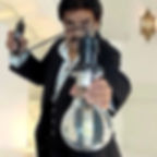 Shahid Malik shows off the large clear Light Bulb.