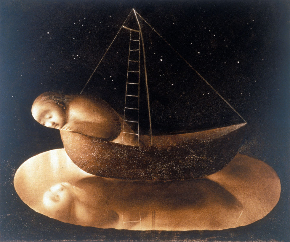 Man in a boat in a puddle leaning out to contemplate his reflection on the water.