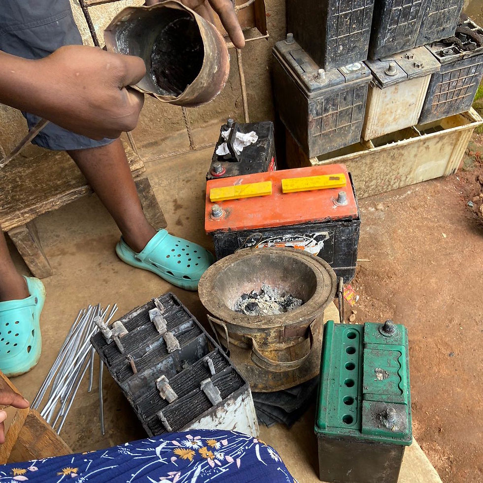 A battery repair worker explaining how he melts battery separators to repair broken battery components in Mtandile, Malawi.