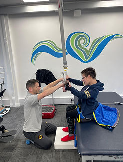 Specialist personal trainer using Guldmann gait trainer