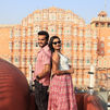 Tourist couple enjoying the photoshoot in Jaipur from the Tatto cafe front of Hawamahal.