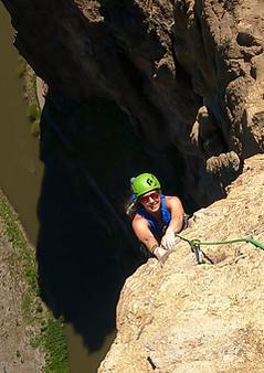 Kate hanging off the edge at Smith Rock, Oregon