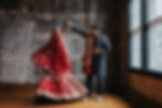 Indian married couple, traditional wedding clothes, man spinning bride, industrial chic wedding venue