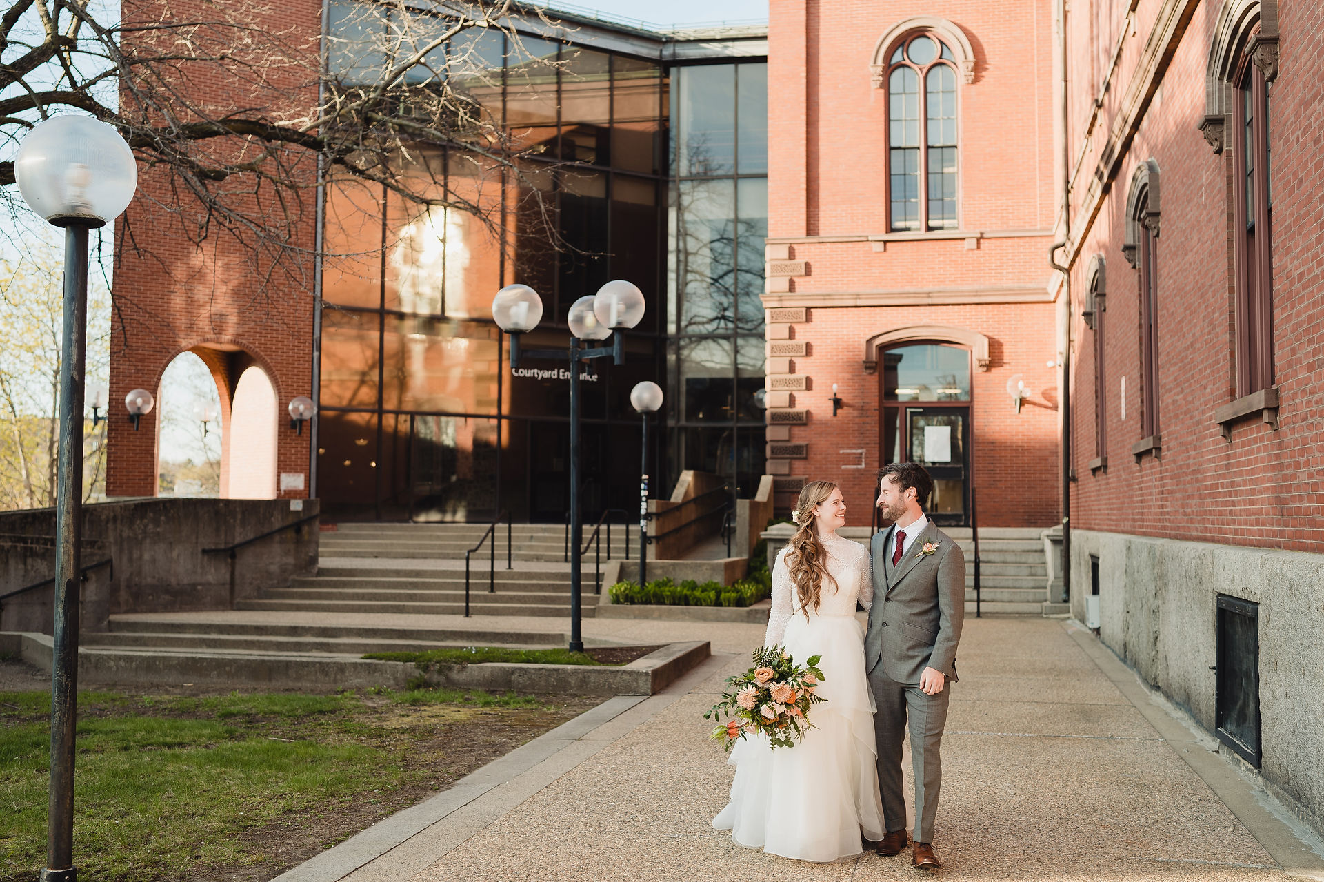 April wedding in New England bride and groom outside