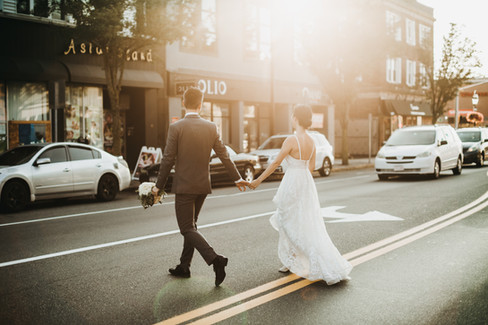 August wedding New England bride and groom crossing Main Street