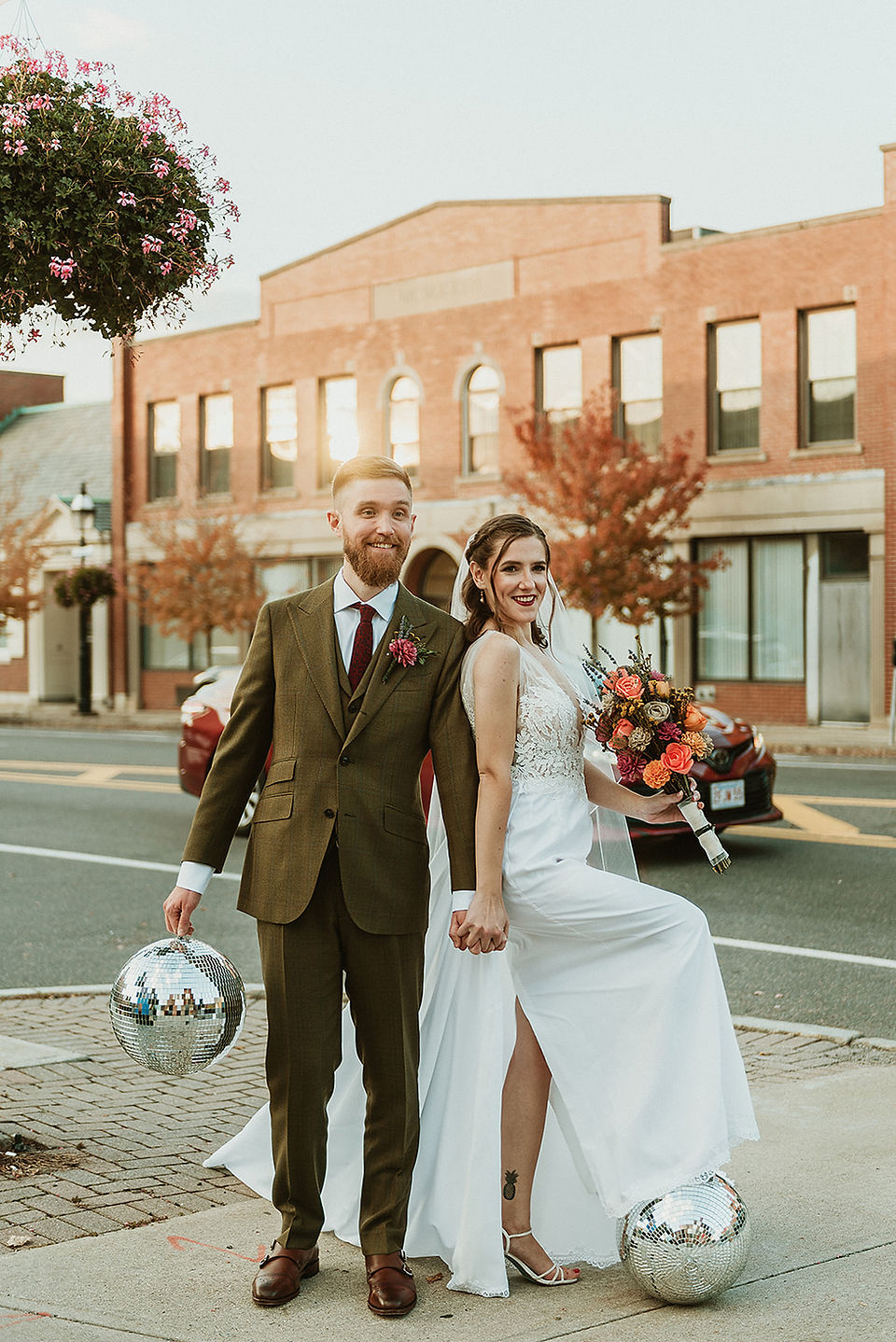 Bride and groom photo downtown with disco balls and flowers in Peabody Massachusetts wedding day
