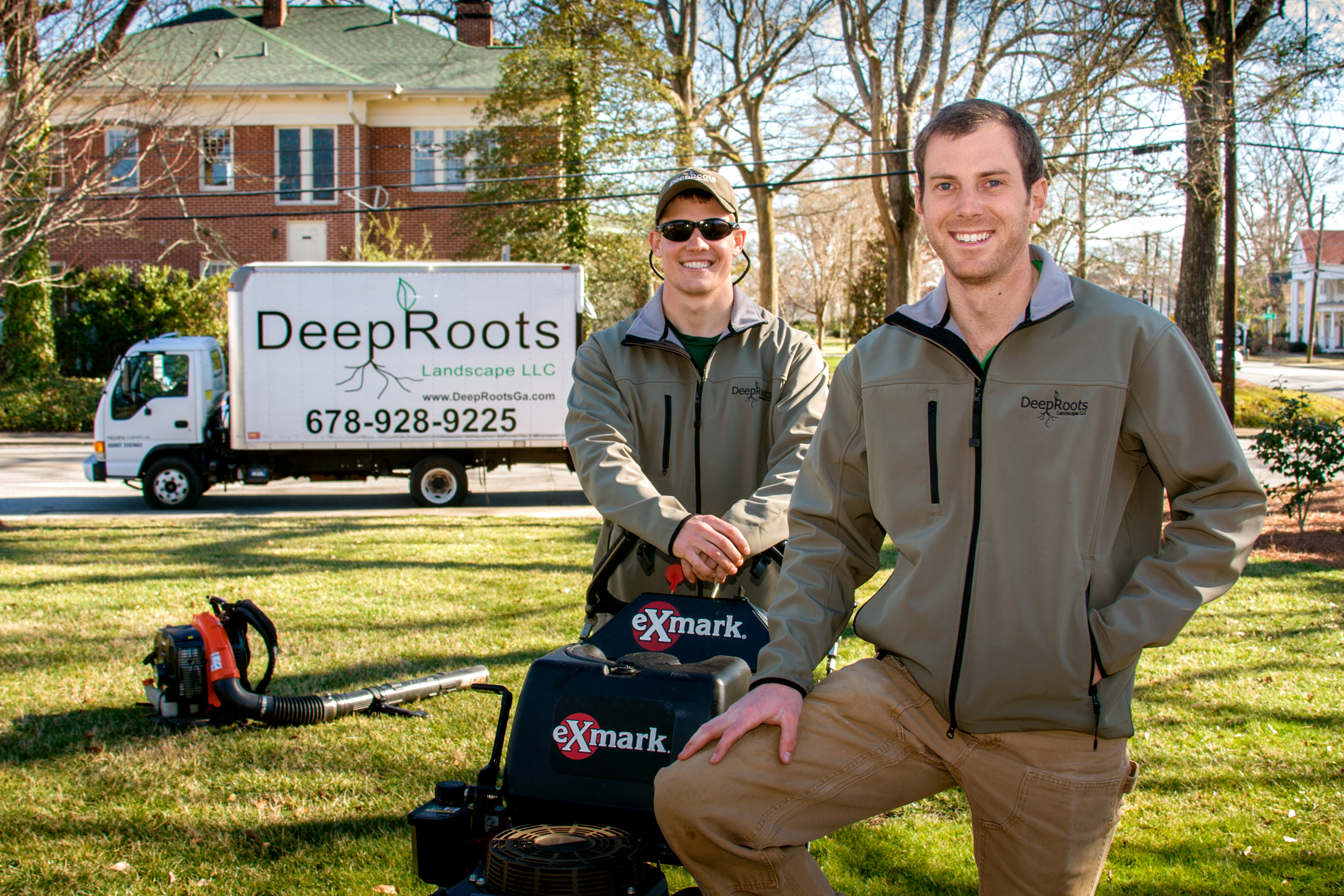 John Baxter and Ben Filchak, Deep Roots Landscape co-owners, on the job with landscaping truck and gear 