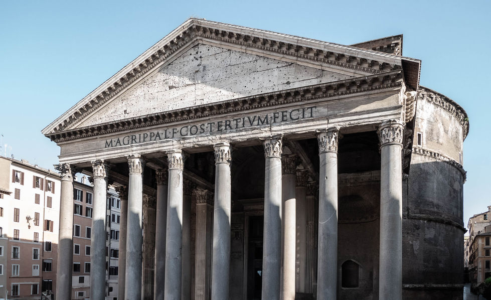 Front view of the Pantheon in Rome, featuring eight Corinthian columns, a triangular pediment, and an inscription honoring Marcus Agrippa; classical Roman architecture with symmetrical design and historical significance