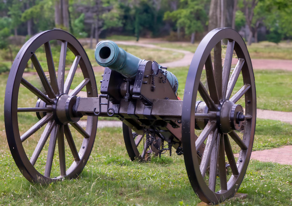 Historic cannon with large wooden wheels photographed by Jean Banzhoff