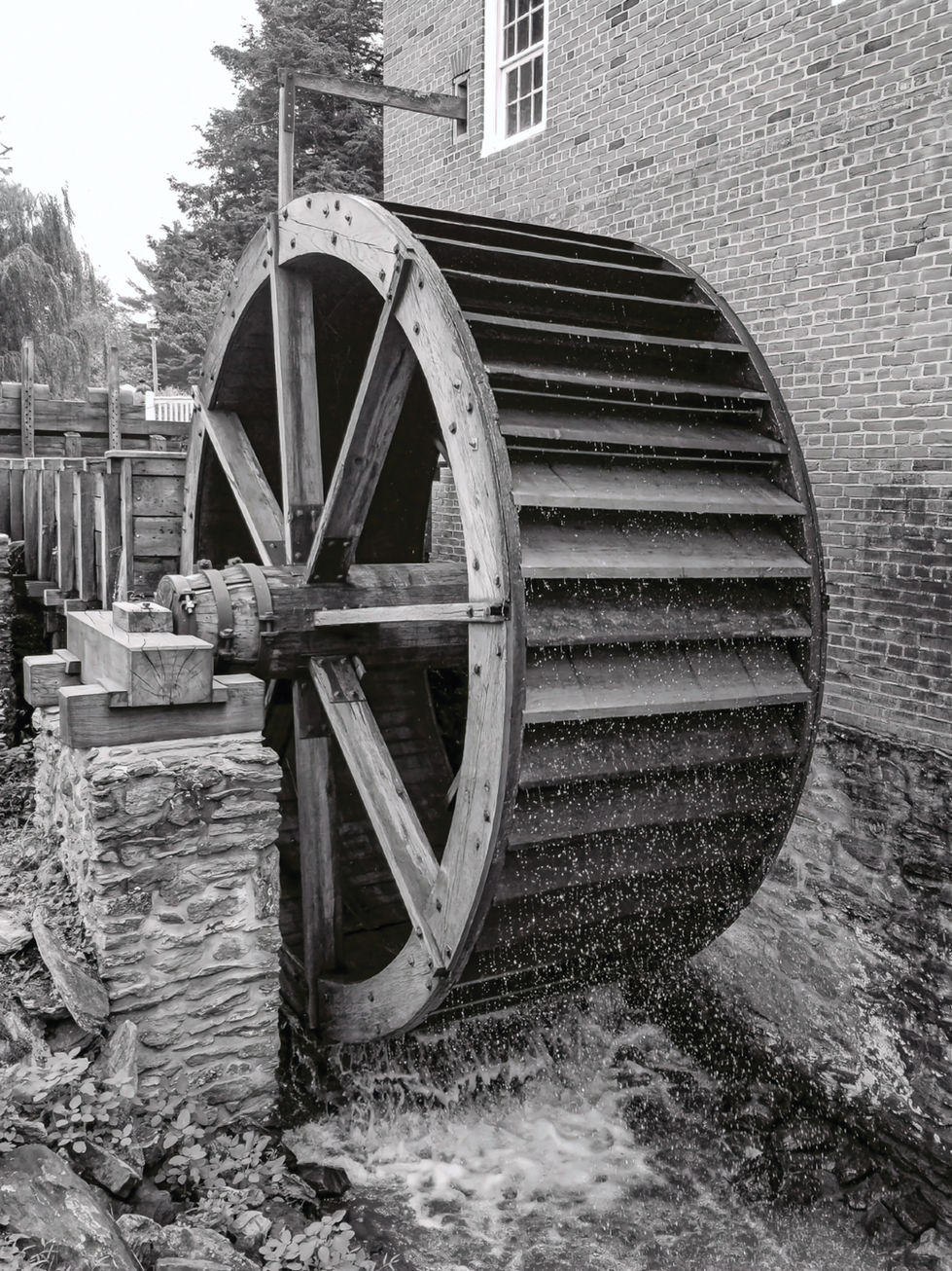 Water wheel turning, flowing water, brick building, Architecture, historic structure, old mill.