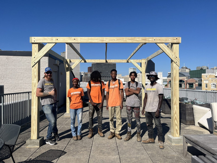 unCommon Construction staff and apprentices pose in front of MSJE’s Sukkah. Attribution: Museum of t