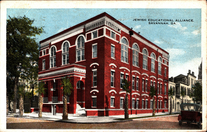 A vipostcard of a red-brick building on a corner in Savannah